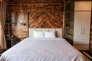 Postel nebo postele na pokoji v ubytování The Mong Garden Homestay SaPa