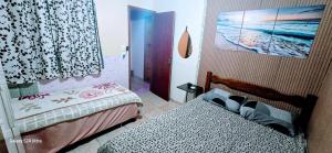 Postel nebo postele na pokoji v ubytování QUARTO para casal com BANHEIRO COMPARTILHADO