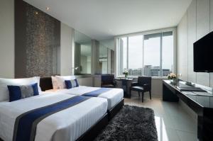 Televisyen dan/atau pusat hiburan di Mandarin Hotel Managed by Centre Point