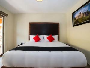 Postel nebo postele na pokoji v ubytování Hotel Colonial Acopinalco Inn