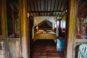 Ένα ή περισσότερα κρεβάτια σε δωμάτιο στο Cening Bagus Bungalow +50 φωτογραφίες