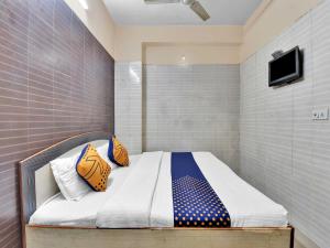 Voodi või voodid majutusasutuse OYO 85212 Hotel Vaibhav toas +17 fotot