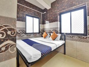 Voodi või voodid majutusasutuse OYO 85212 Hotel Vaibhav toas