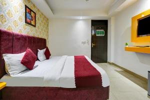 Postel nebo postele na pokoji v ubytování Hotel Kelvish Free Airport Pickup