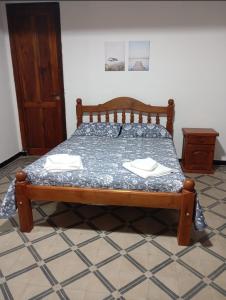 a bed in a room with two napkins on it at La Casa del Centro in La Rioja