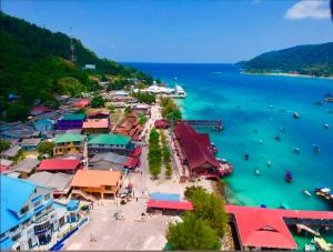 an aerial view of a harbor with boats in the water at Perhentian Najmi Hotel in Perhentian Islands