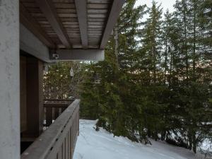 a balcony of a house with snow on the ground at Courchevel 1850: Duplex charmant 6 pers près centre, parking, wifi - FR-1-631-228 in Courchevel