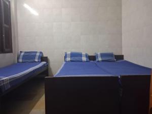 Postel nebo postele na pokoji v ubytování G R MANSION