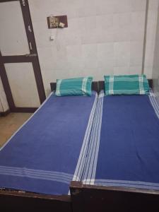 Postel nebo postele na pokoji v ubytování G R MANSION