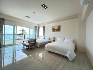 Postel nebo postele na pokoji v ubytování 都蘭那界灣海景民宿 + 60 fotografií