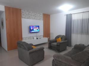 TV a/nebo společenská místnost v ubytování G&R Apart