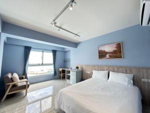 Postel nebo postele na pokoji v ubytování 那界灣海景民宿 Dulan Najie Bay Inn + 16 fotografií