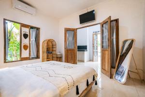 Postel nebo postele na pokoji v ubytování SIN Ubud + 33 fotografií