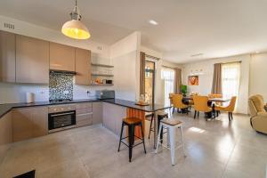 Η κουζίνα ή μικρή κουζίνα στο Sea of Dreams Apartments