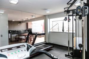 a room with a gym with a treadmill at Hotel Rio Vermelho in Goiânia