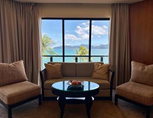 a living room with a couch and a table at Shangri-La Tanjung Aru, Kota Kinabalu in Kota Kinabalu