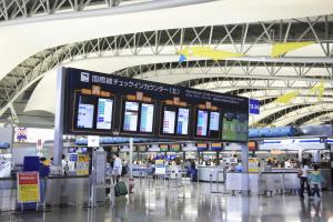 an airport terminal with people waiting for their flights at Osaka - Hotel / Vacation STAY 65254 in Osaka +22 photos