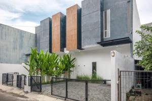 a building with a fence in front of it at INNCA The Amerta Private Villa, Solo in Solo