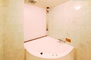 a small bathroom with a tub and a sink at Osaka - Hotel / Vacation STAY 70127 in Osaka +38 photos
