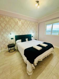Ένα ή περισσότερα κρεβάτια σε δωμάτιο στο Imperium Apartamentos Centro Parking Gratis +37 φωτογραφίες
