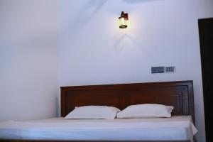 Postel nebo postele na pokoji v ubytování Villa Utopia Mirissa