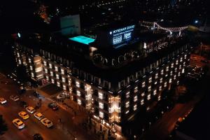 an overhead view of a building at night at Wyndham Grand Istanbul Kalamış Marina Hotel in Istanbul