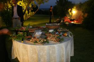 a table with a buffet of food on it at Hotel Spartivento in Chia