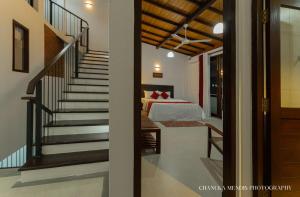 Postel nebo postele na pokoji v ubytování Sithmi Homes