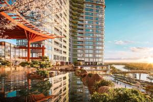 a rendering of a tall building with a river in front at Onsen Landmark Luxury Apartments in Kim Quan