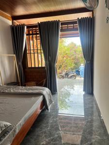 Postel nebo postele na pokoji v ubytování Homestay Bảo Lộc Ngọc Kim