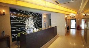 a lobby with a large painting on the wall at Circle Hotel Seoul in Seoul