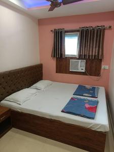 Postel nebo postele na pokoji v ubytování Hotel Globe International