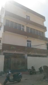 two motorcycles parked in front of a building at Hotel Silver Park and Restaurant in Bilāspur +9 photos
