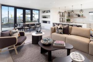 a living room with a couch and a table at Blueground San Pedro wd nr USS Iowa LAX-1317 in Los Angeles