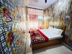 Ένα ή περισσότερα κρεβάτια σε δωμάτιο στο Hotel Bali Inn