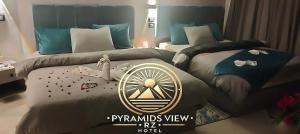 Krevet ili kreveti u jedinici u objektu Pyramids View R Z Hotel
