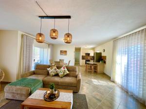 a living room with a couch and a table at Central Cozy Apartment at Ane court in Swakopmund
