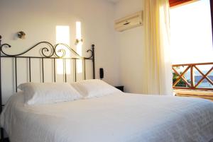 Hotel De La Barra tesisinde bir odada yatak veya yataklar