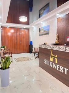 a lobby of a smile nest dental clinic with a reception desk at Silk Nest Hotel in Bukhara