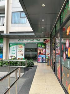 a person standing in the entrance to a shopping mall at Rose homestay Vinhomes Grand Park 1 bed room in Long Bình +6 photos