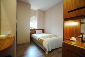 Postel nebo postele na pokoji v ubytování York Hotel