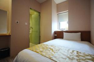 Postel nebo postele na pokoji v ubytování York Hotel
