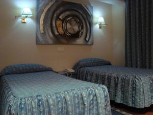 Voodi või voodid majutusasutuse Hotel San Antonio toas