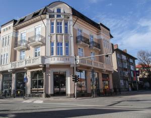 a large building on the corner of a street at Corner House in Lovech