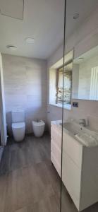 a bathroom with a toilet and a sink at Casa Escuela Sanguñedo in Magdalena