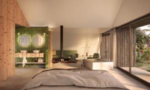 a bedroom with a large bed and a fireplace at Herdade do Ananás in Ponta Delgada