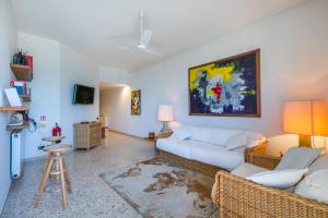 a living room with a couch and a table at Italianway - Rossetti 3 in Marina di Cecina