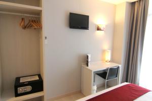 TV a/nebo společenská místnost v ubytování Hostal Aslyp 114
