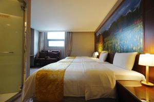 Postel nebo postele na pokoji v ubytování York Hotel