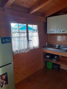 Kuchyň nebo kuchyňský kout v ubytování EDERA Parco Vacanze